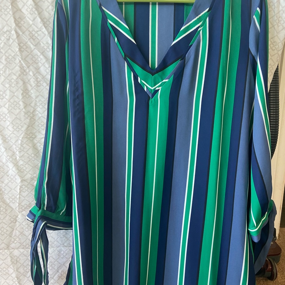 White, green, blue striped shirt, with ties and the end of each sleeve